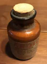 Antique brown medicine bottle with cork in top 1 oz. lable old Doctor Not Opened