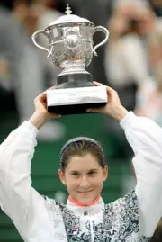 Monica Seles of Yugoslavia lifts the trophy after defeating Steffi- Old Photo