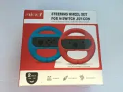 Set Of Two NIntendo Switch Joy-Con Steering Wheel Handle Grips - Red & Blue