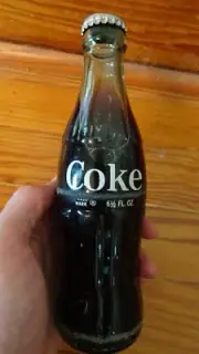 New Unopened Sealed Glass Vintage Coke Bottle with Coke in it. 6 1/2 Oz