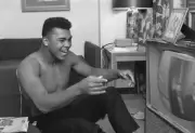 Cassius Clay laughing while watching himself on television Clay wo- Old Photo 3