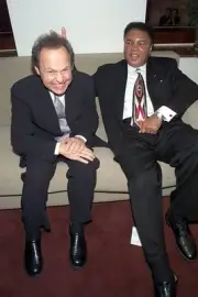 Billy Crystal and Muhammad Ali during Audemars Piguet's time to gi- Old Photo
