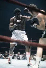 Ron Lyle in action vs Jerry Quarry during fight at Madison S - 1973 Old Photo