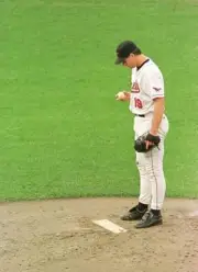 Pitcher Scott Erickson Baltimore Orioles stares down at the mound - Old Photo