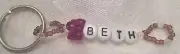 PERSONALIZED KEYCHAIN OR ZIPPER PULL WITH THE NAME BETH-HAND MADE-NEW