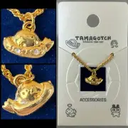 1997 Bandai Tamagotchi UFO Spaceship Gold Tone Necklace Accessory Collection