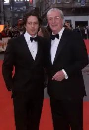 British actors Michael Caine and Hugh Grant arrive at the BAFTA Aw- Old Photo