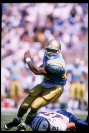 Tailback Skip Hicks UCLA Bruins runs over linebacker Jimmy Sprotte- Old Photo
