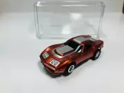 AFX tras CANDY COPPER CORVETTE AW Chassis & Display case Aurora NEW!