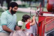 Pittsburgh Steelers Franco Harris plays on the playground with chi- Old Photo