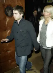 Musician Noel Gallagher of the pop group Oasis Sarah McDonald arri- Old Photo