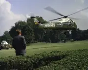 President John F. Kennedy watches Marine One helicopter lift off New 8x10 Photo