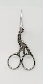 Silver stainless steel antique scissor. Sewing handicrafts tool.