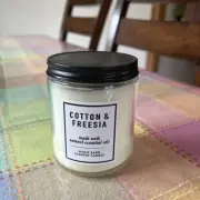 White barn candle cotton and freesia 7 Oz.