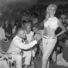 Painter Claude LePape draws a unicorn on bare midriff a young - 1961 Old Photo