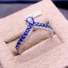 Lab Created Pear Shape Blue Sapphire Eternity Engagement Band Ring In 935 Silver