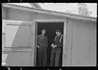 Photo:Lumberjacks in doorway of bunkhouse, near Effie, Minnesota