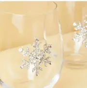 2 stemless wine glasses featuring a gorgeous rhinestone snowflake