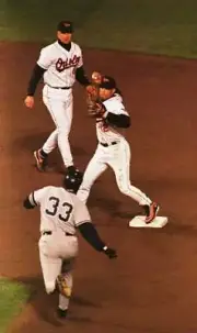 Second baseman Roberto Alomar Baltimore Orioles completes the firs- Old Photo