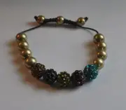 KIRKS FOLLY BEADED CORD BRACELET MULTIPLE COLOR BEADS IN GOLD TONE