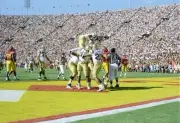 Tailback Skip Hicks UCLA Bruins celebrates his touchdown with team- Old Photo
