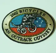 VINTAGE 2002 BICYCLES OUTBACK ODYSSEY SOUVENIR PATCH WOVEN CLOTH SEW-ON BADGE