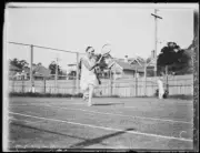 Miss Valkenberg running to return tennis ball during a match, NSW, - Old Photo