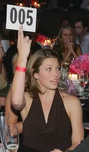 Actress Jessica Biel bids on an item at the launch of the uBid for - Old Photo 1