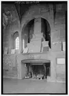 20. INDIAN HOUSE FIREPLACE; NORTH WALL. THE FIREPLACE IS SURROUNDED BY RELIEF
