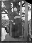 Archbishop Michael Kelly standing on a verandah before a crowd, NS - Old Photo