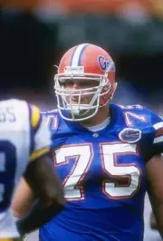Offensive guard Donnie Young Florida Gators looks on during a g- 1996 Old Photo