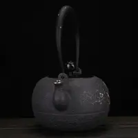 在飛比找ETMall東森購物網優惠-純手工砂鐵壺鑲嵌純銀圖案日式生鐵壺無涂層功夫茶燒水鐵壺泡茶壺
