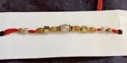 IGP Gold/Red Pearl Bead Rakhi Bracelet - Oval bead (13196)