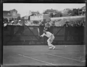 Japanese tennis player Takeichi Harada crouching to return the bal- Old Photo