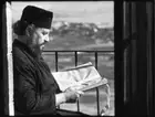 Palestine Mount Quarantina Jericho priest reading on verandah of G - Old Photo