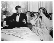 Cary Grant dressed in a tuxedo and Ingrid Bergman wearing a nightg- Old Photo