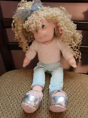 TY Beanie Kid blonde with blue bow, white top, and light blue pants