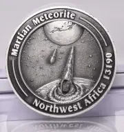 MARTIAN METEORITE WITH COLLECTORS COIN 0401, NORTH WEST AFRICA 13190 MT39