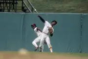Paul Blair Baltimore Orioles makes a throw back into the infield - 1974 Photo