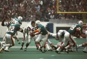 Bob Griese Miami Dolphins turns to hand the ball to running back - 1974 Photo