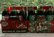 Assorted Superbowl Coke Bottles 8 fluid ounces with Paper carrier unopened NEW