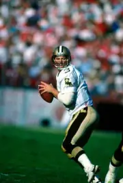 Quarterback Bobby Hebert New Orleans Saints drops back to pa- Football Photo 2