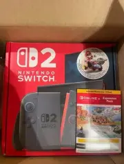 Nintendo switch 2 console in hand with Mario kart world and more. Costco bundle