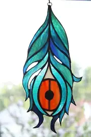 Stained-glass suncatcher of a peacock feather handmade