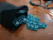 100 AQUA DICE, BRAND NEW + VELVET DRAW STRING BAG.