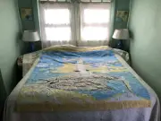 Handmade ocean-themed quilt with lighthouse