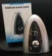 PENDULUM ARCH ALARM CLOCK. Silver. Brand New in box - never used. $25 obo.
