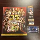 WWE 35 Years of WrestleMania Hardcover Book w/ Undertaker Card & WM12 Bookmark