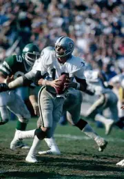 Quarterback Ken Stabler Oakland Raiders drops back to pass v the - 1974 Photo