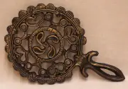 CAST IRON TRIVET WITH GOLDEN COLOR ACCENT HANDLE HEARTS